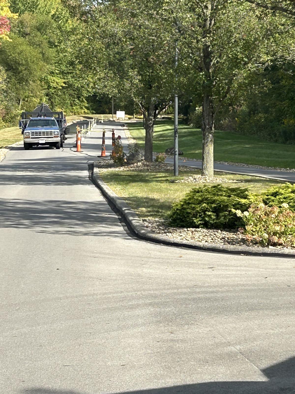 Campus or commercial drive with spray truck