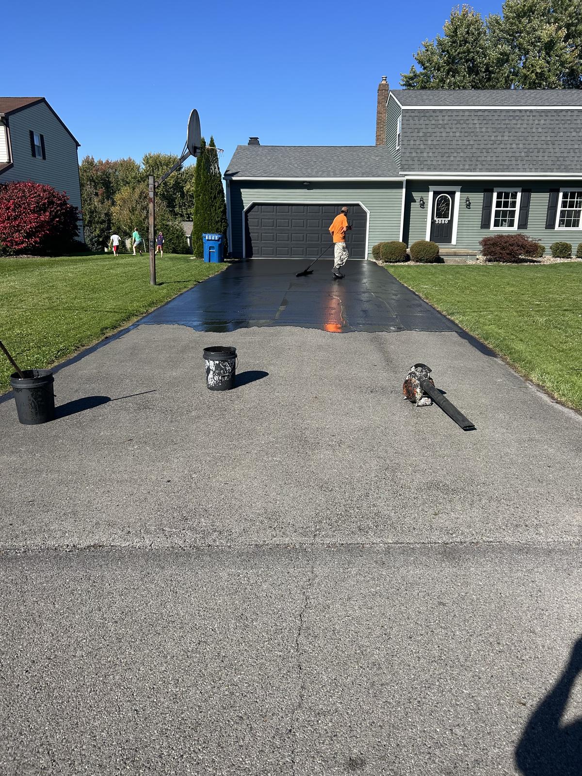 Fresh sealcoat on a residential driveway